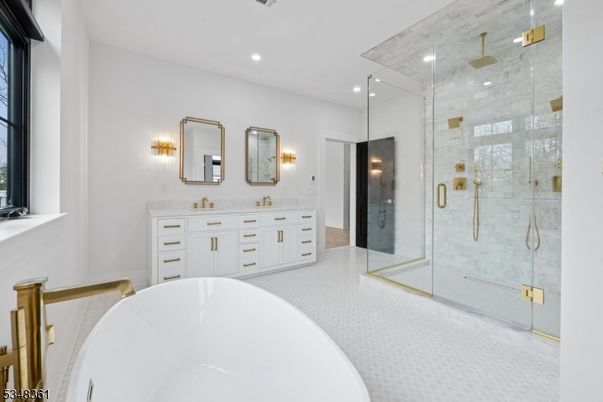 Bathroom, Dual Sink Vanities, Free Standing Baths, Glass Shower, Interior, Marble Walls, Recessed Lighting