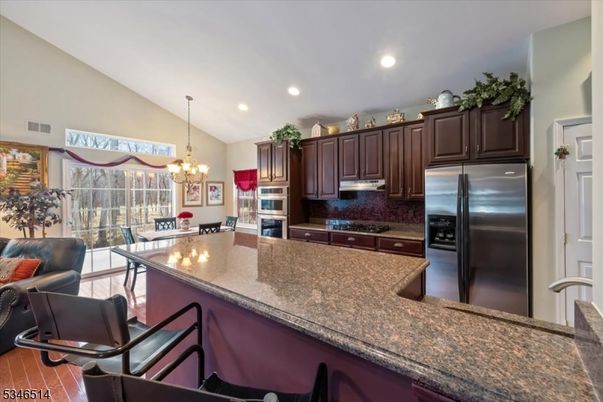 Chandelier, Dining room, Interior, Kitchen, Recessed Lighting, Stainless Steel Appliances, Wood Texture Flooring