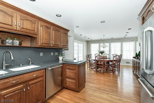 Dining room, Interior, Kitchen, Pendant Lights, Recessed Lighting, Stainless Steel Appliances, Wood Texture Flooring