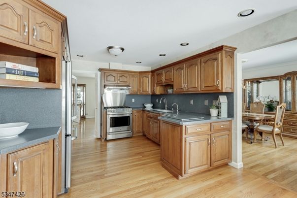 Dining room, Interior, Kitchen, Recessed Lighting, Stainless Steel Appliances, Wood Texture Flooring