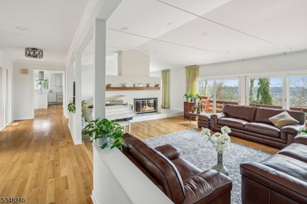 Fireplace, Interior, Living room, Piano, Recessed Lighting, Wood Texture Flooring