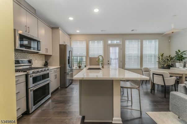 Dining room, Interior, Kitchen, Pendant Lights, Recessed Lighting, Stainless Steel Appliances, Wood Texture Flooring
