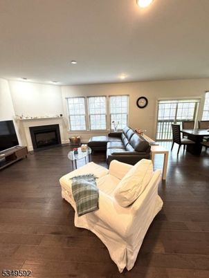 Dining room, Fireplace, Interior, Living room, Recessed Lighting, Wood Texture Flooring