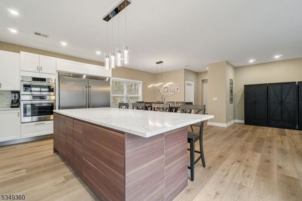 Dining room, Interior, Kitchen, Pendant Lights, Recessed Lighting, Stainless Steel Appliances, Wood Texture Flooring