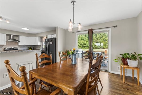 Dining room, Interior, Kitchen, Pendant Lights, Recessed Lighting, Stainless Steel Appliances, Wood Texture Flooring