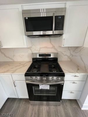 Interior, Kitchen, Marble Walls, Stainless Steel Appliances, Wood Texture Flooring