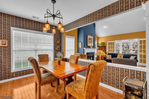 Dining room, Fireplace, Interior, Living room, Pendant Lights, Recessed Lighting, Wood Texture Flooring