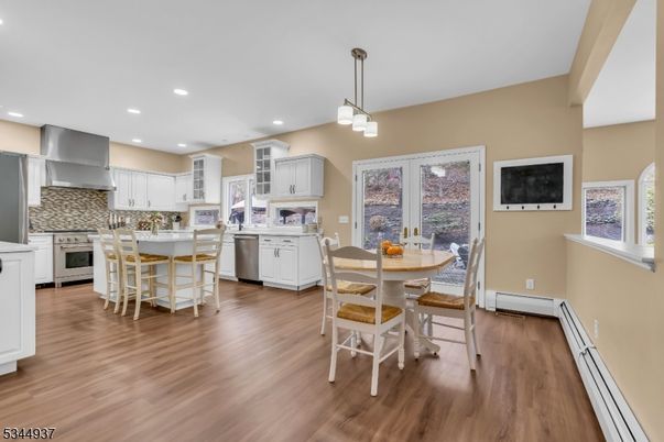 Dining room, Interior, Kitchen, Pendant Lights, Recessed Lighting, Stainless Steel Appliances, Wood Texture Flooring