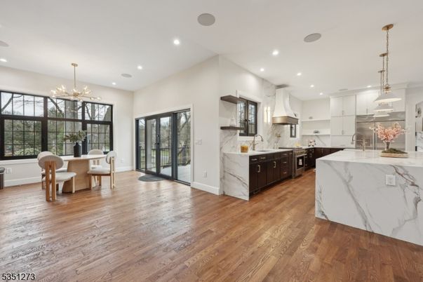 Dining room, Interior, Kitchen, Marble Walls, Pendant Lights, Recessed Lighting, Stainless Steel Appliances, Wood Texture Flooring