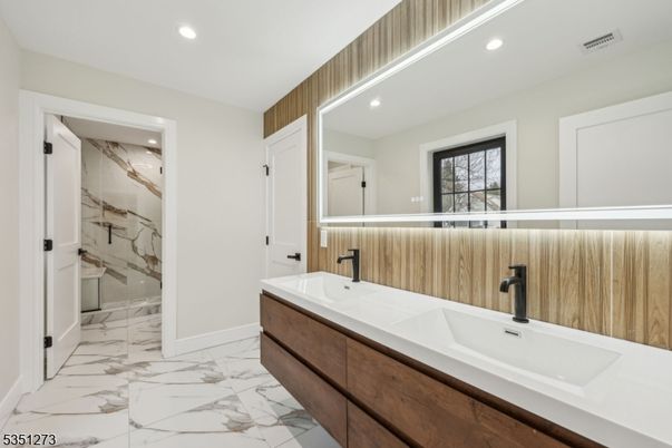 Bathroom, Dual Sink Vanities, Glass Shower, Interior, Marble, Marble Walls, Recessed Lighting