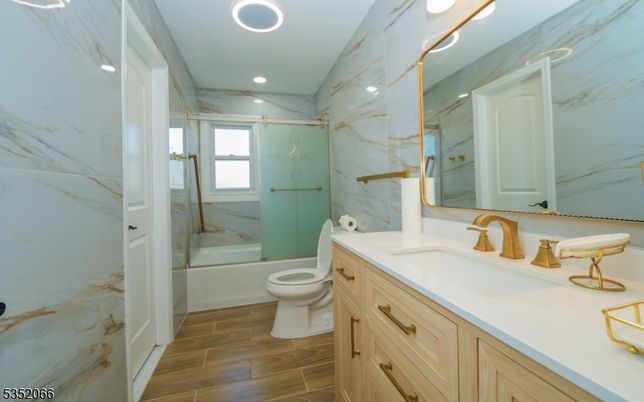 Bathroom, Glass Shower, Interior, Marble Walls, Recessed Lighting, Wood Texture Flooring