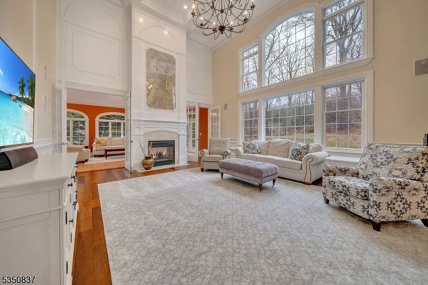 Chandelier, Fireplace, Interior, Living room, Recessed Lighting, Wood Texture Flooring