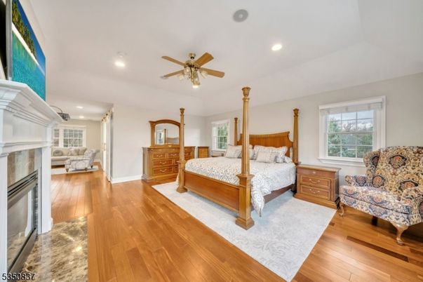 Bedroom, Fireplace, Interior, Recessed Lighting, Wood Texture Flooring