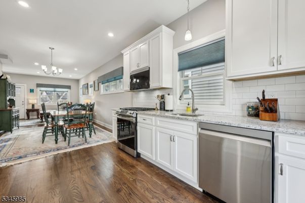 Chandelier, Dining room, Interior, Kitchen, Pendant Lights, Recessed Lighting, Stainless Steel Appliances, Wood Texture Flooring