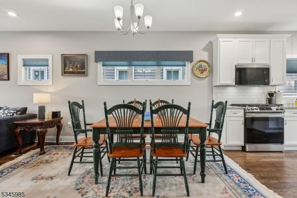Chandelier, Dining room, Interior, Kitchen, Recessed Lighting, Stainless Steel Appliances, Wood Texture Flooring