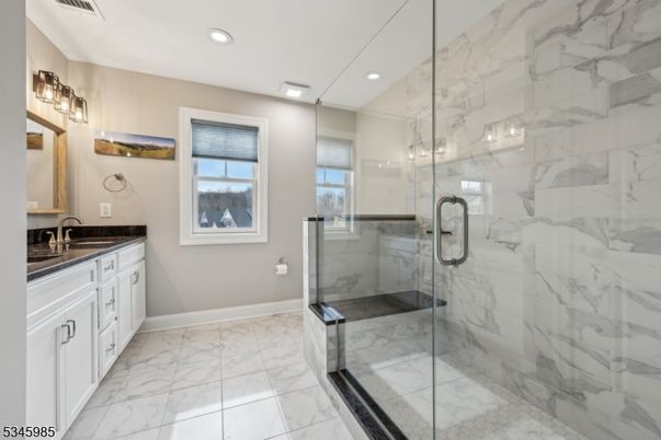 Bathroom, Dual Sink Vanities, Glass Shower, Interior, Marble, Marble Walls, Recessed Lighting