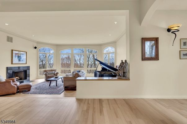 Fireplace, Interior, Living room, Piano, Recessed Lighting, Wood Texture Flooring