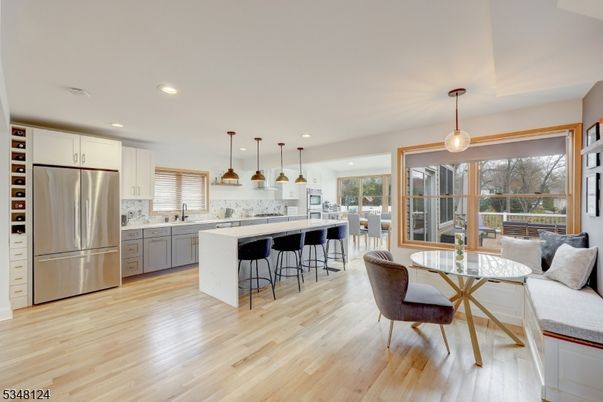 Dining room, Interior, Kitchen, Pendant Lights, Recessed Lighting, Stainless Steel Appliances, Wood Texture Flooring