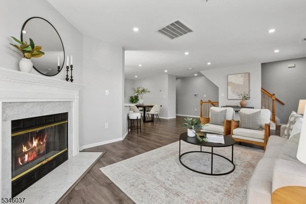 Dining room, Fireplace, Interior, Living room, Recessed Lighting, Wood Texture Flooring