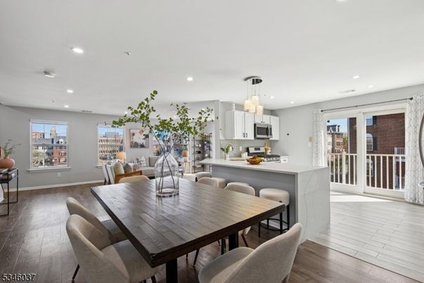 Chandelier, Dining room, Interior, Kitchen, Pendant Lights, Recessed Lighting, Stainless Steel Appliances, Wood Texture Flooring