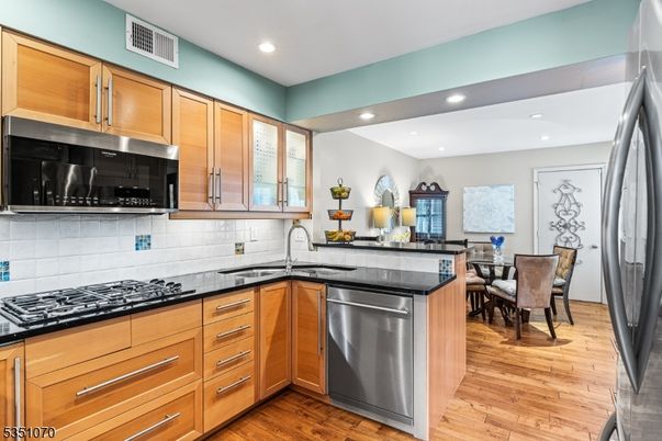 Dining room, Interior, Kitchen, Recessed Lighting, Stainless Steel Appliances, Wood Texture Flooring