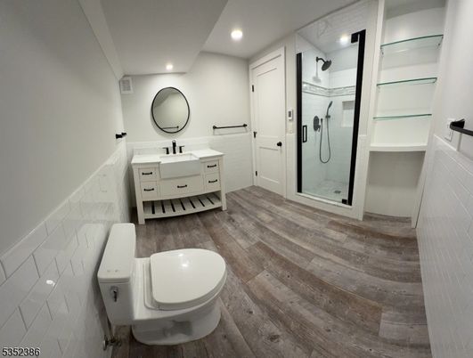 Bathroom, Dual Sink Vanities, Glass Shower, Interior, Recessed Lighting, Wood Texture Flooring