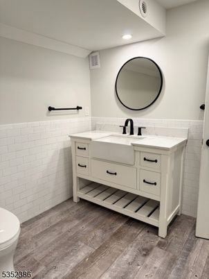 Bathroom, Dual Sink Vanities, Interior, Recessed Lighting, Wood Texture Flooring