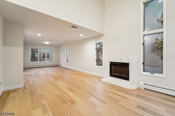 Empty room, Fireplace, Interior, Recessed Lighting, Wood Texture Flooring
