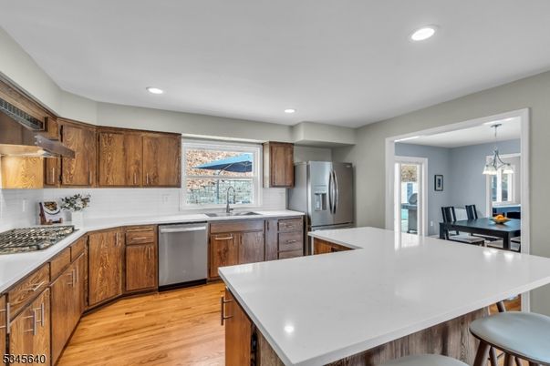 Dining room, Interior, Kitchen, Pendant Lights, Recessed Lighting, Stainless Steel Appliances, Wood Texture Flooring