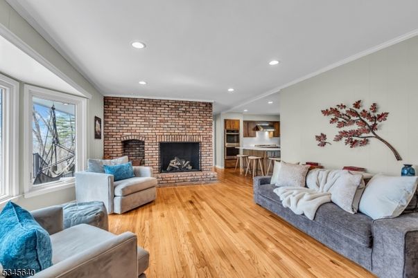 Fireplace, Interior, Kitchen, Living room, Recessed Lighting, Stainless Steel Appliances, Stone Walls, Wood Texture Flooring