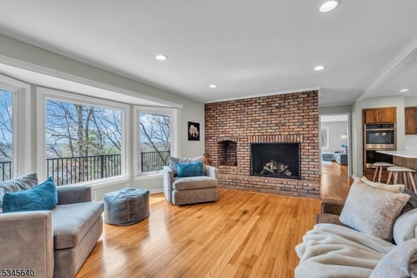 Fireplace, Interior, Kitchen, Living room, Recessed Lighting, Stone Walls, Wood Texture Flooring