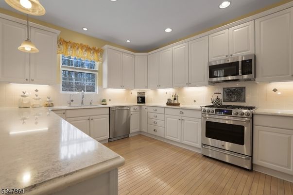 Interior, Kitchen, Pendant Lights, Recessed Lighting, Stainless Steel Appliances, Wood Texture Flooring