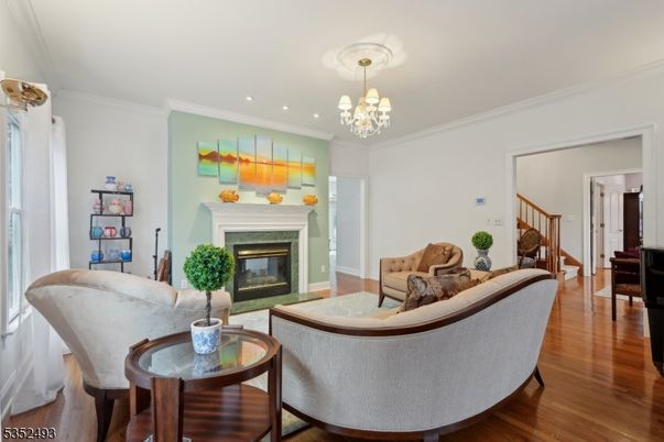 Chandelier, Fireplace, Interior, Living room, Recessed Lighting, Wood Texture Flooring