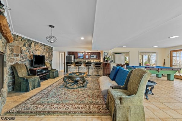 Billiard Table, Fireplace, Game Room, Interior, Kitchen, Living room, Pendant Lights, Recessed Lighting, Stone Walls