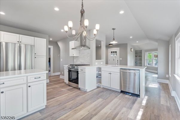 Chandelier, Interior, Kitchen, Pendant Lights, Recessed Lighting, Stainless Steel Appliances, Wood Texture Flooring