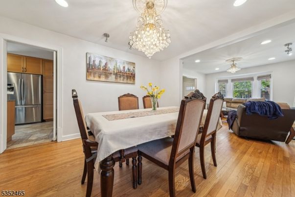 Chandelier, Dining room, Interior, Kitchen, Living room, Recessed Lighting, Stainless Steel Appliances, Wood Texture Flooring