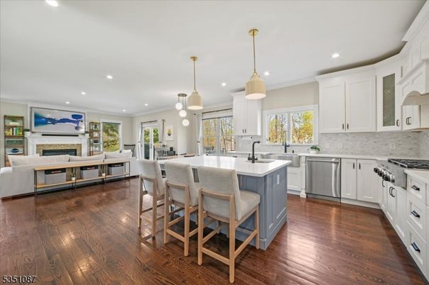 Fireplace, Interior, Kitchen, Living room, Pendant Lights, Recessed Lighting, Stainless Steel Appliances, Wood Texture Flooring
