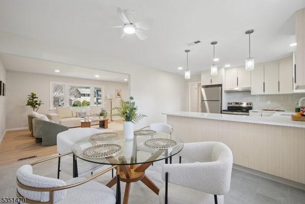 Dining room, Interior, Kitchen, Living room, Pendant Lights, Recessed Lighting, Stainless Steel Appliances, Wood Texture Flooring