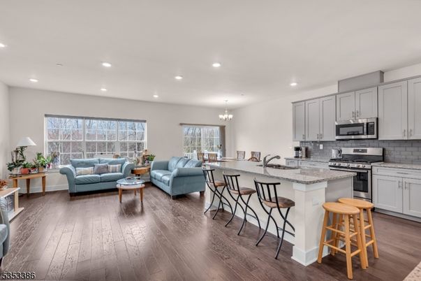 Chandelier, Dining room, Interior, Kitchen, Living room, Recessed Lighting, Stainless Steel Appliances, Wood Texture Flooring