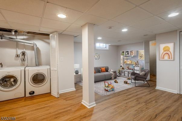 Interior, Living room, Recessed Lighting, Utility Closets, Washer, Wood Texture Flooring