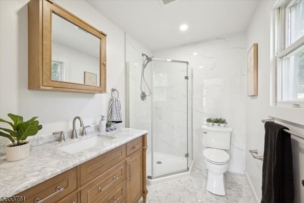 Bathroom, Dual Sink Vanities, Glass Shower, Interior, Marble, Marble Walls, Recessed Lighting
