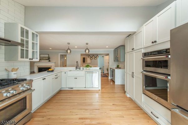 Fireplace, Interior, Kitchen, Pendant Lights, Recessed Lighting, Stainless Steel Appliances, Wood Texture Flooring