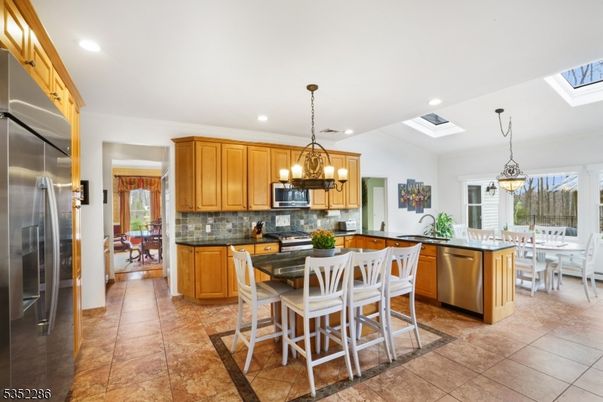 Chandelier, Dining room, Interior, Kitchen, Pendant Lights, Recessed Lighting, Stainless Steel Appliances