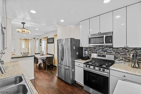 Chandelier, Dining room, Interior, Kitchen, Recessed Lighting, Stainless Steel Appliances, Wood Texture Flooring