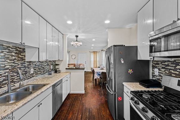 Chandelier, Dining room, Interior, Kitchen, Pendant Lights, Recessed Lighting, Stainless Steel Appliances, Wood Texture Flooring