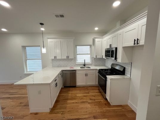 Interior, Kitchen, Pendant Lights, Recessed Lighting, Stainless Steel Appliances, Wood Texture Flooring