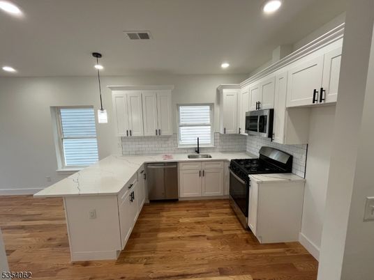 Interior, Kitchen, Pendant Lights, Recessed Lighting, Stainless Steel Appliances, Wood Texture Flooring