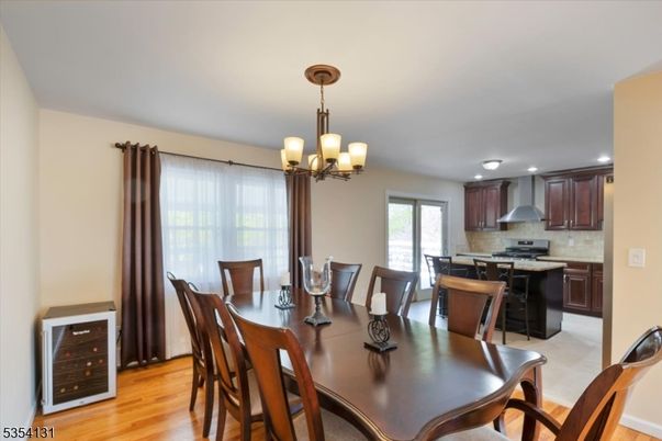 Chandelier, Dining room, Interior, Kitchen, Recessed Lighting, Stainless Steel Appliances, Wood Texture Flooring
