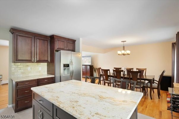 Chandelier, Dining room, Interior, Kitchen, Stainless Steel Appliances, Wood Texture Flooring