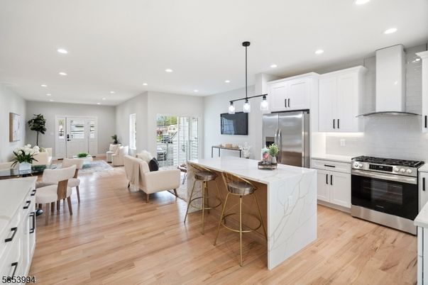 Dining room, Interior, Kitchen, Living room, Pendant Lights, Recessed Lighting, Stainless Steel Appliances, Wood Texture Flooring